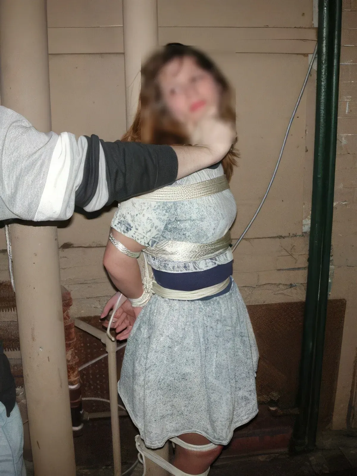 Blurred portrait of a restrained person indoors, with face obscured to support privacy in kink dating profile safety. Blurred portrait of a restrained person indoors, with face obscured to support privacy in kink dating profile safety.